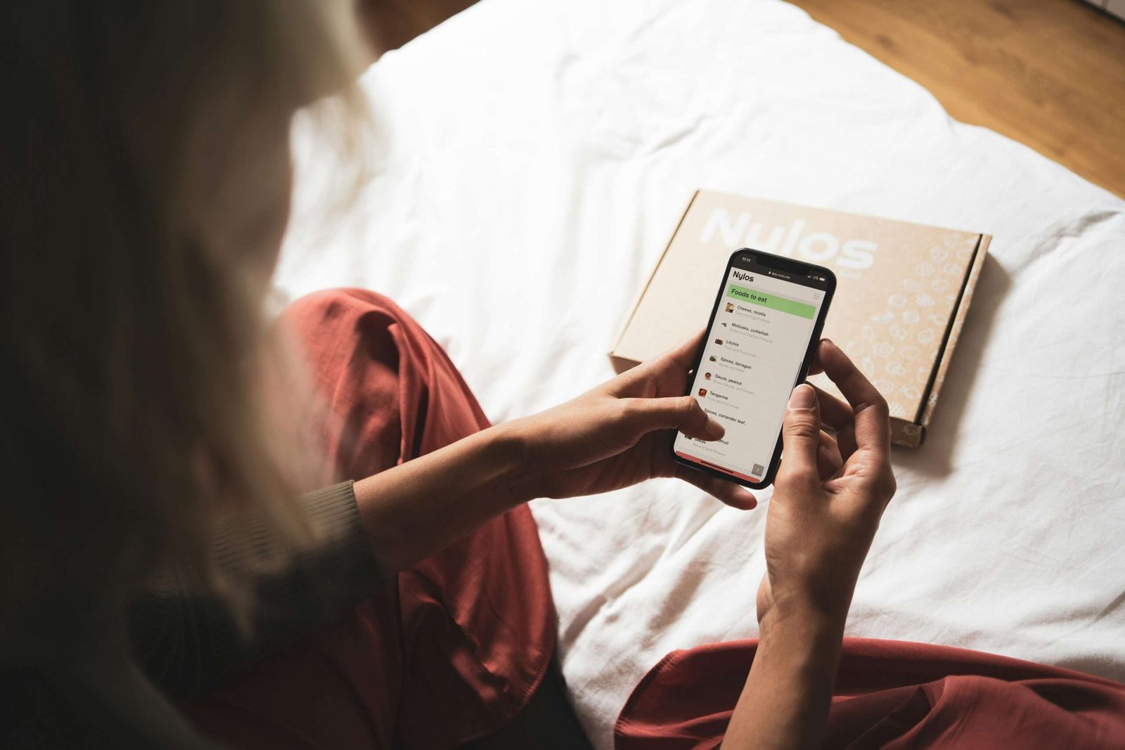 person holding white android smartphone